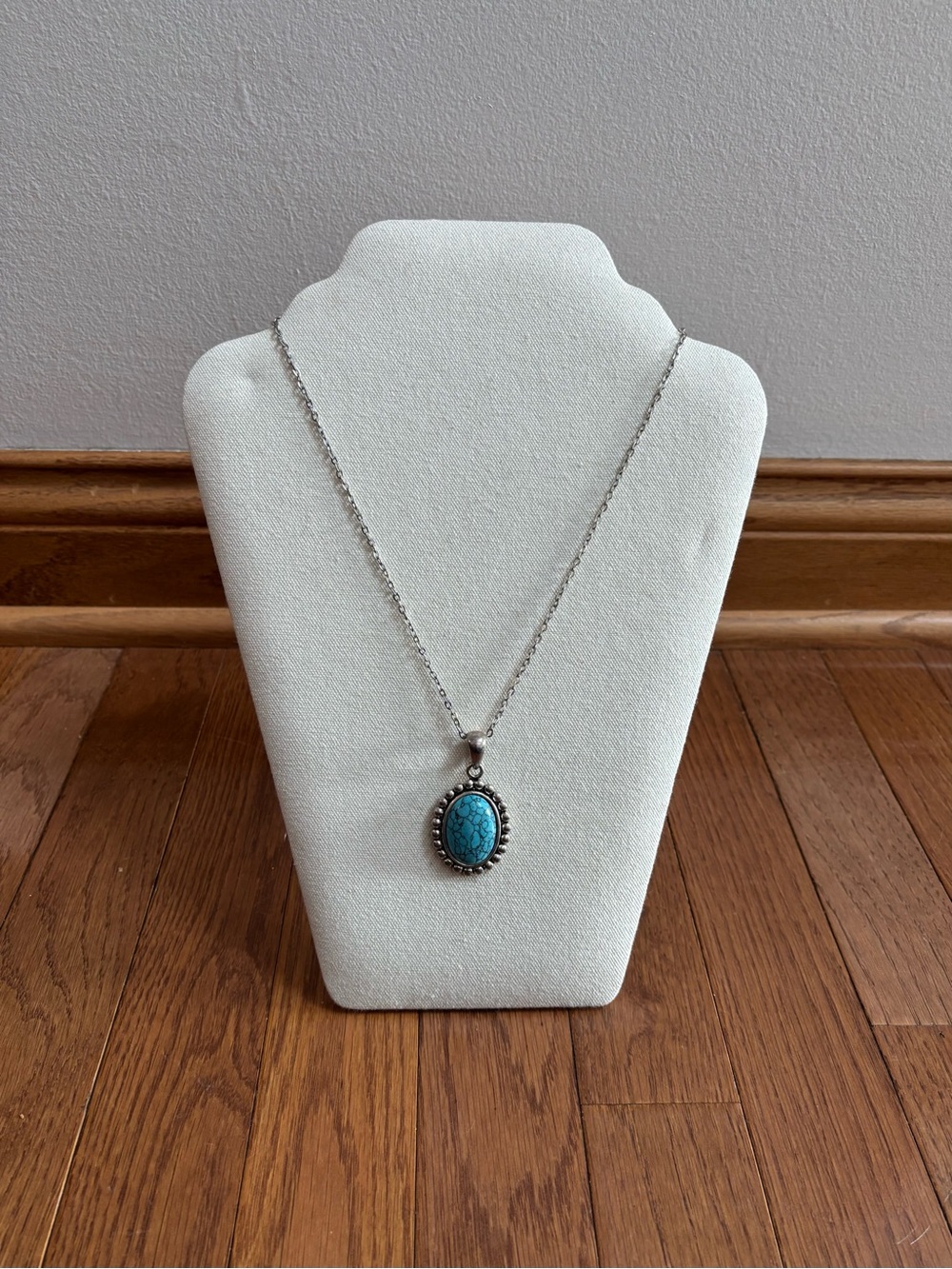 Silver Tone Drop Down Chain Necklace with Ornate Framed Turquoise Stone
